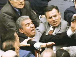  ??  ?? A fistfight erupted on the floor of the Turkish parliament on Tuesday following the passage of a controvers­ial election law