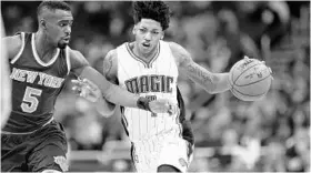  ?? RICARDO RAMIREZ BUXEDA/STAFF FILE PHOTO ?? PG Elfrid Payton, right, has missed an essential part of the Magic’s preseason schedule.