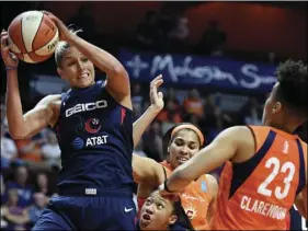  ??  ?? In this June 11 file photo, Washington Mystics forward Elena Delle Donne pulls down a rebound next to Connecticu­t Sun guard Layshia Clarendon during a WNBA basketball game in Uncasville, Conn. SEAN D. ELLIOT/THE DAY VIA AP