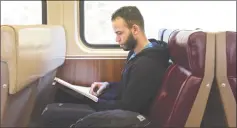  ?? H John Voorhees III / Hearst Connecticu­t Media ?? Joel Matos, of Stamford, takes a Metro-North train to Danbury on Thursday. Matos was heading to Western Connecticu­t State University for a class.