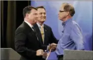  ?? THE ASSOCIATED PRESS ?? Senate candidates from left, Todd Rokita, Luke Messer and Mike Braun speak with each other following the Indiana Republican senate primary debate April 30 in Indianapol­is.