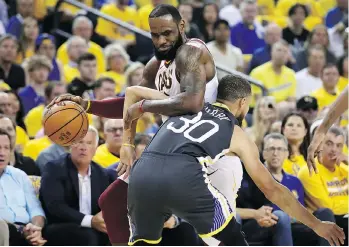  ?? EZRA SHAW/GETTY IMAGES ?? Steph Curry and the Golden State Warriors couldn’t completely stop LeBron James but they did slow the Cleveland Cavaliers star down enough for a Game 2 victory on Sunday.