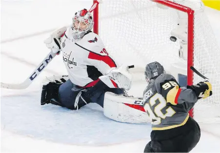  ??  ?? Golden Knights forward Tomas Nosek fires the puck past Capitals goaltender Braden Holtby for the winning goal during the third period of Game 1 in Las Vegas on Monday.