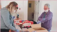  ??  ?? Volunteers Ailsa Yuill and Mhairi Reid hard at work at Kintyre Food Bank.