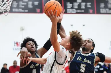  ?? PHOTO BY ANDY HOLZMAN ?? Harvard-Westlake's Trent Perry, center, is defended by St. John Bosco's Brandon McCoy Jr. and Kade Bonam on Friday.