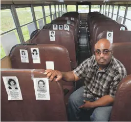  ?? SAM UPSHAW JR./USA TODAY ?? Quinton Higgins, 45, was 15 years old when the bus crash happened. He turned a replica of the bus into a mobile memorial.