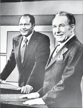  ?? Los Angeles Times ?? TOM BRADLEY, left, and Sam Yorty prepare to debate in 1973. Bradley, a former cop and councilman, beat incumbent Yorty to become the city’s fist Black mayor.