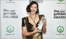  ?? Photos and text from The Associated Press ?? Maggie Gyllenhaal holds the best screenplay award in the winners room at the Gotham Awards at Cipriani Wall Street on Monday in New York.