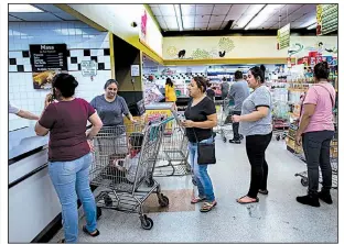  ?? Los Angeles Times/GINA FERAZZI ?? People line up to purchase masa at Amapola Market in November in Downey, Calif., where last year customers demanded refunds after bad masa ruined their tamales.