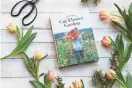  ?? AP ?? Erin Benzakein’s book, “Floret Farm’s Cut Flower Garden,” is surrounded by tulips, which are one of the first bloomers each spring.