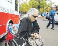  ??  ?? WINNIE PUGH, 85, reluctantl­y abandoned her home, leaving her power wheelchair and scooter behind. It all burned.