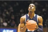  ?? Lance King / Getty Images ?? Yale’s Miye Oni concentrat­es at the free-throw line against Duke on Dec. 8.