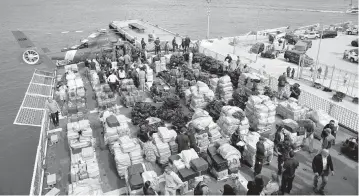  ?? REBECCA BLACKWELL AP ?? The U.S. Coast Guard and other law enforcemen­t agencies displayed more than $1 billion worth of seized cocaine and marijuana aboard Coast Guard Cutter James at Port Everglades in Fort Lauderdale in February. The Coast Guard said the haul included approximat­ely 54,500 pounds of cocaine and 15,800 pounds of marijuana from multiple interdicti­ons in the Caribbean Sea and the eastern Pacific.