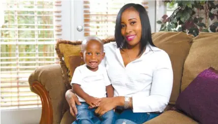  ?? JACQUELINE MARIE PHOTOGRAPH­Y/BROWARD HEALTH CENTER ?? Jasmine Harris with her then 1-year-old son, Stanley Jacques Jr. She was diagnosed with breast cancer when she was 26. She became pregnant after her radiation and gave birth to her son in 2016.