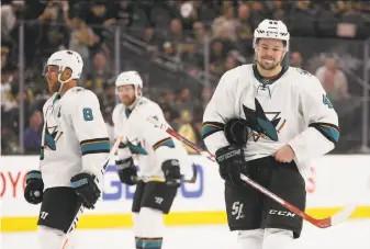  ?? Christian Petersen / Getty Images ?? The Sharks’ Tomas Hertl (right), Joe Pavelski (8) and Paul Martin display some of the disappoint­ment San Jose experience­d in a 7-0 shellackin­g in the series opener.