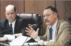  ?? ASSOCIATED PRESS ?? IN THIS NOV. 9, 2015, FILE PHOTO, Arizona state Rep. Mark Finchem, R-Tucson (right), speaks during a Joint Border Security Advisory Committee at the Arizona Capitol as Arizona House Speaker David Gowan, R- Sierra Vista, listens in Phoenix.