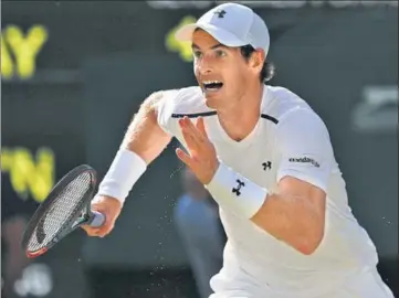  ?? AP ?? Andy Murray runs to make a return to Dustin Brown during their Wimbledon second round match in London on Wednesday.