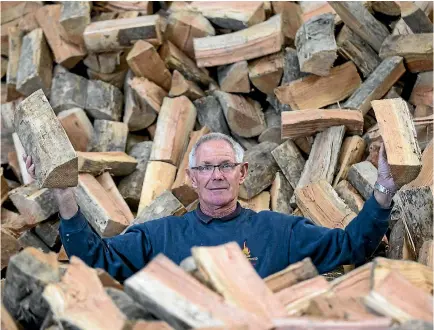  ?? PHOTO: DOUG FIELD/STUFF ?? Topcut Firewood owner Don George at his firewood shed.