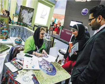  ?? Ahmed Ramzan/Gulf News ?? Rising demand Visitors at the Iran stand at the Arabian Travel Market. Hotel occupancy levels in Iran increased from 58 per cent in 2013 to 79 per cent in 2014.