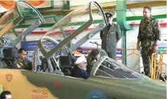  ??  ?? A handout picture released by the Iranian Presidency shows Rouhani sitting in the cockpit of the ‘Kowsar’ domestic fighter jet equipped with ‘advanced avionics’and multi-purpose radar. — AFP photo