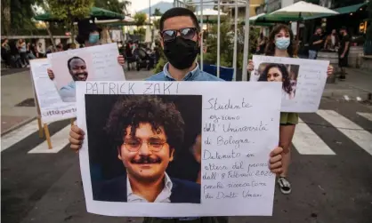  ?? Photograph: Ivan Romano/Getty Images ?? A protester holds up a picture of Patrick Zaki at a demonstrat­ion in Naples, Italy.