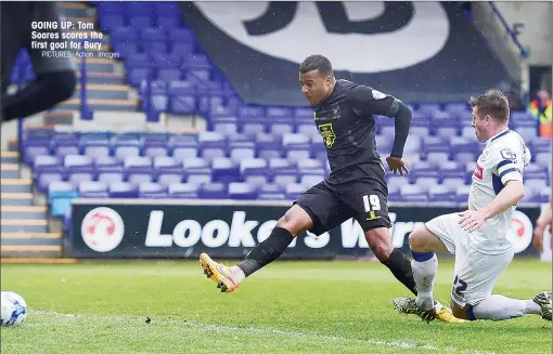  ?? PICTURES: Action Images ?? GOING UP: Tom Soares scores the first goal for Bury