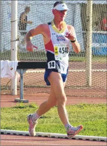  ??  ?? Race walker Chris Hobbs help Great Britain win a team bronze in the World Masters Athletics Championsh­ips