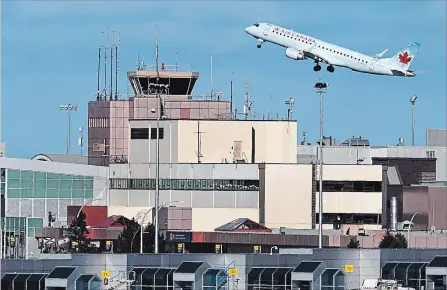  ?? THE CANADIAN PRESS FILE PHOTO ?? Air Canada had a $77-million net loss in the second quarter and sharply lower adjusted earnings compared with the same time last year as the airline grappled with losses from the sale of some aircraft and higher jet fuel prices.