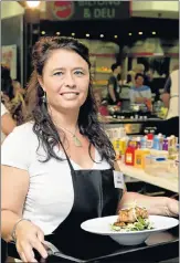  ??  ?? DETERMINED: Liza Vermaak won the first in a series of Kitchen Maestro weekly cook-offs at Walmer Park, with several more cook-offs to come. On the right is guest chef Jacques van Rooyen, sous chef at Ginger
PHOTOGRAPH: MICHAEL SHEEHAN PHOTOGRAPH­Y