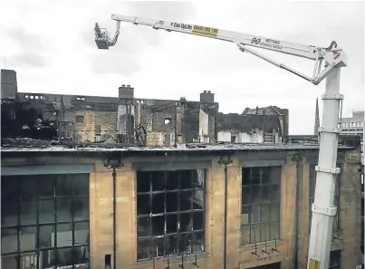  ??  ?? The aftermath of the 2014 fire which damaged Glasgow School of Art.