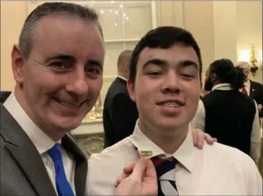  ?? SUBMITTED PHOTO ?? U.S. Rep. Brian Fitzpatric­k shows the “Pennridge Proud” pin on Justin Lyons’ collar at a reception prior to President Donald Trump’s Feb. 5 State of the Union speech in Washington, D.C.