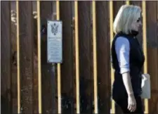  ?? GREGORY BULL — THE ASSOCIATED PRESS ?? U.S. Department of Homeland Security Secretary Kirstjen Nielsen walks away from a plaque adorning a newly fortified border wall structure Friday in Calexico