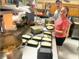  ?? Photo by Amy Cherry ?? Zak and Janice Breniman, owners of Dream Catch eatery, are shown preparing homemade meals inside their new, larger location along the Million Dollar Highway in St. Marys.