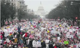  ?? MARIO TAMA / GETTY IMAGES ?? Protesters walk during the Women’s March on Washington, D.C., Saturday. The march in the U.S. capital was a message to misogynist demagogues everywhere, writes Kate Heartfield, that we aren’t going back to the bad old days.