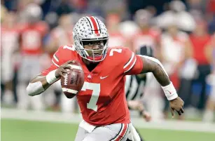  ?? AP Photo/Darron Cummings ?? ■ Ohio State quarterbac­k Dwayne Haskins (7) looks to throw during the first half of the Big Ten championsh­ip game against Northweste­rn on Saturday in Indianapol­is. Haskins was named offensive player of the year when The Associated Press All-Big Ten Conference team was released Wednesday.