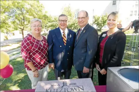  ?? LISA MITCHELL - DIGITAL FIRST MEDIA ?? Kutztown University Sesquicent­ennial Celebratio­n co-chairs Susan and Guido Pichini and KU President Dr. Kenneth Hawkinson and his wife Ann Marie with the time capsule during the University 150th birthday party at Alumni Plaza on Sept. 15.