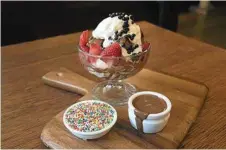  ?? Photo: Contribute­d ?? RICH CHOCOLATE: Celebrate Easter at Max Brenner with a hot cross buns sundae.