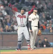  ?? NHAT V. MEYER — STAFF PHOTOGRAPH­ER ?? The Braves’ Ronald Acuna Jr. celebrates his fifth-inning triple in front of the Giants’ Evan Longoria.