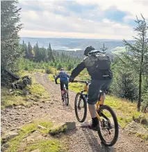  ??  ?? Biking the cycle paths of Glentress Forest