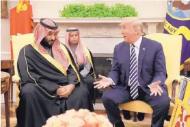  ?? EVAN VUCCI/ASSOCIATED PRESS ?? President Donald Trump meets with Saudi Crown Prince Mohammed bin Salman in the Oval Office of the White House on March 20 in Washington, D.C.