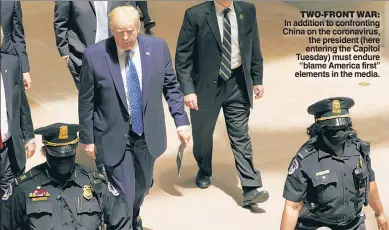  ??  ?? TWO-FRONT WAR: In addition to confrontin­g China on the coronaviru­s, the president (here entering the Capitol Tuesday) must endure “blame America first” elements in the media.