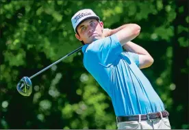  ?? RAY CARLIN/STAR-TELEGRAM/AP PHOTO ?? J.T. Poston tees off on the 12th hole during the first round of the Dean & DeLuca Invitation­al on Thursday at Colonial Country Club in Fort Worth, Texas.