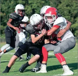  ??  ?? Chattanoog­a Valley’s Jesse Dunwoody collides with Lakeview’s Will Carroll during a game this past Thursday in Flintstone. The Eagles won 30-14. (Photo by Bambara Aven/www.bbaven.com)