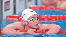  ?? XINHUA ?? Li Bingjie reacts after winning the silver medal in the women’s 1,500m freestyle on Tuesday.