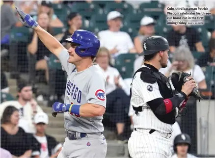  ?? NAM Y. HUH/AP ?? Cubs third baseman Patrick Wisdom celebrates his threerun home run in the first inning Friday.