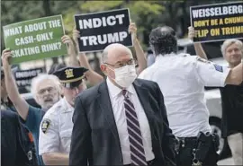  ?? John Minchillo Associated Press ?? JURY SELECTION in the tax fraud trial of the Trump Organizati­on and finance chief Allen Weisselber­g, shown arriving at court in New York, is set for Oct. 24.