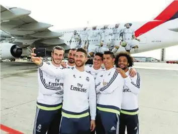  ?? Courtesy: Emirates ?? Let me take a selfie From left: Gareth Bale, Karim Benzema, Sergio Ramos, James Rodriguez, Cristiano Ronaldo and Marcelo checking out the Emirates A380 team decal.