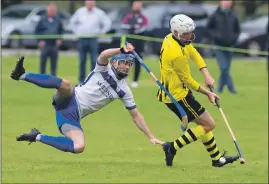  ?? Lawson Photograph: Stephen ?? Calum McLay, GMA, takes a tumble as Hamish McLennan, Inveraray, controls the ball.