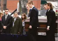  ?? Jim Michaud / Associated Press ?? In this Dec. 30, 2015 photo, Richard Dabate, left, watches the casket bearing his late wife Connie Dabate being carried during her funeral outside St. Bernard Roman Catholic Church in Vernon.