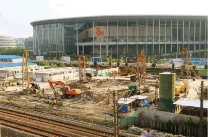  ??  ?? Some renovation work is under way at the National Exhibition and Convention Center, which will host the November China Internatio­nal Import Expo — the biggest event of its kind since the 2010 World Expo. — Wang Rongjiang